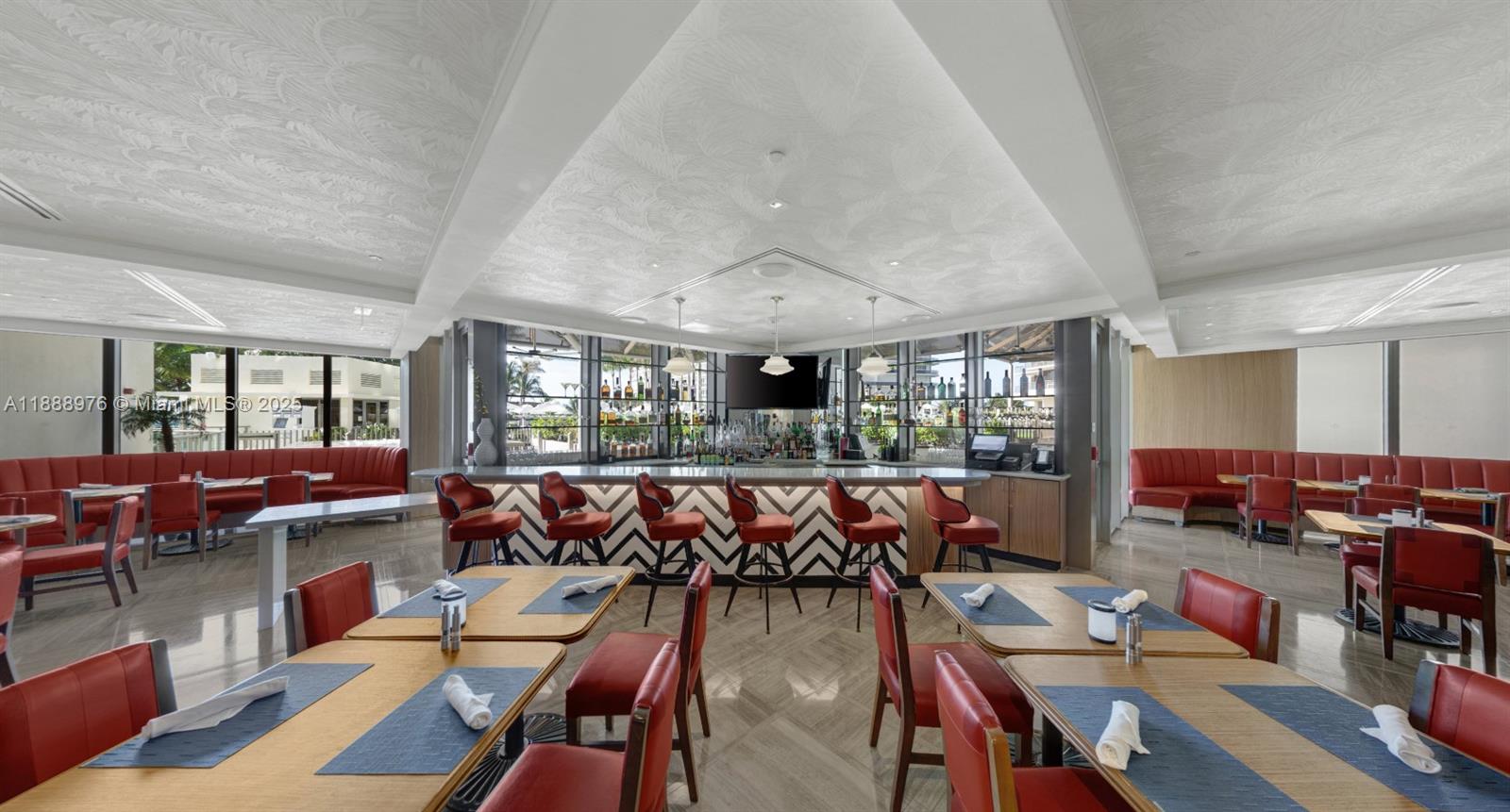 9703 Collins Avenue, Unit 600 Bal Harbour, FL 33154 - Photo 50 of 53 a living room with furniture and a large window