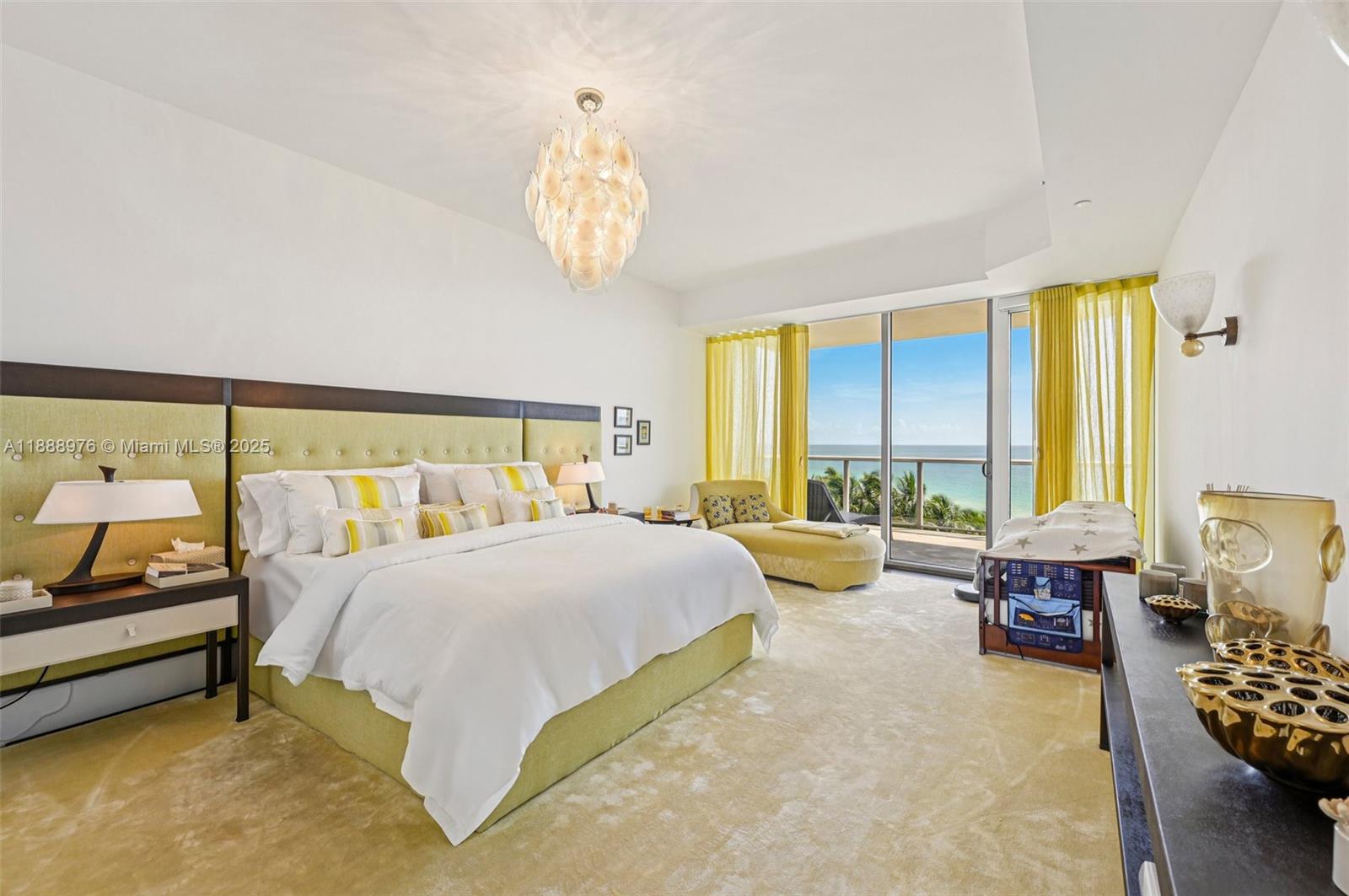 9703 Collins Avenue, Unit 600 Bal Harbour, FL 33154 - Photo 7 of 53 a bedroom with a bed and large windows