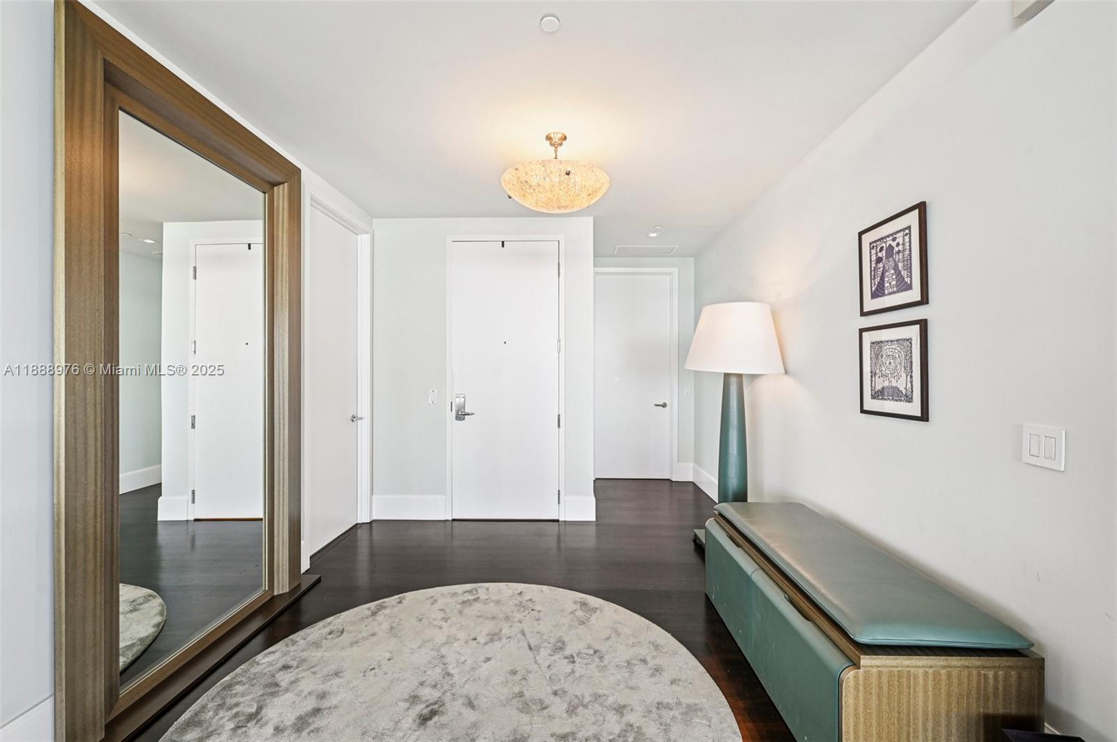 9703 Collins Avenue, Unit 600 Bal Harbour, FL 33154 - Photo 8 of 53 a bedroom with a bed and a lamp