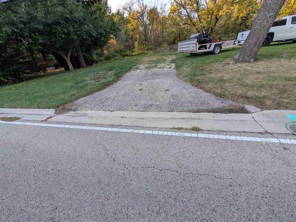 a view of a yard with car parked