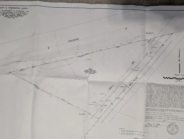 a view of a yard with car parked