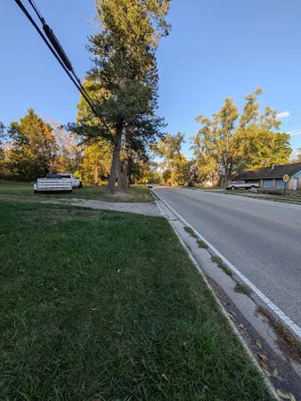 a yard with lots of green space