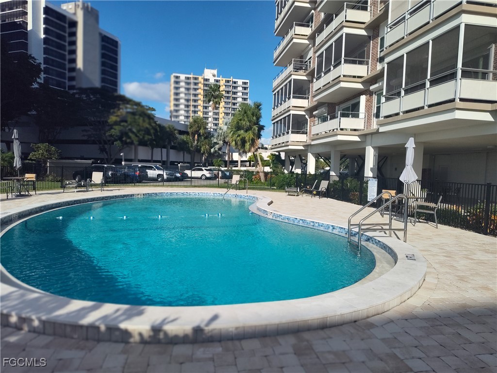2350 West First Street, Unit 203 Fort Myers, FL 33901 - Photo 12 of 15 a view of a swimming pool with a sitting space