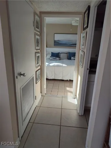 a view of a patio with table and chairs and potted plants
