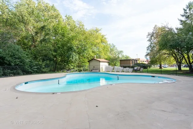 a view of a playground with basketball court