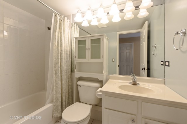 1 Renaissance Place, Unit 706 Palatine, IL 60067 - Photo 7 of 12 a bathroom with a sink toilet and shower