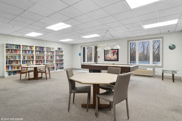 1 Renaissance Place, Unit 706 Palatine, IL 60067 - Photo 10 of 12 a view of a dining room with furniture and chandelier