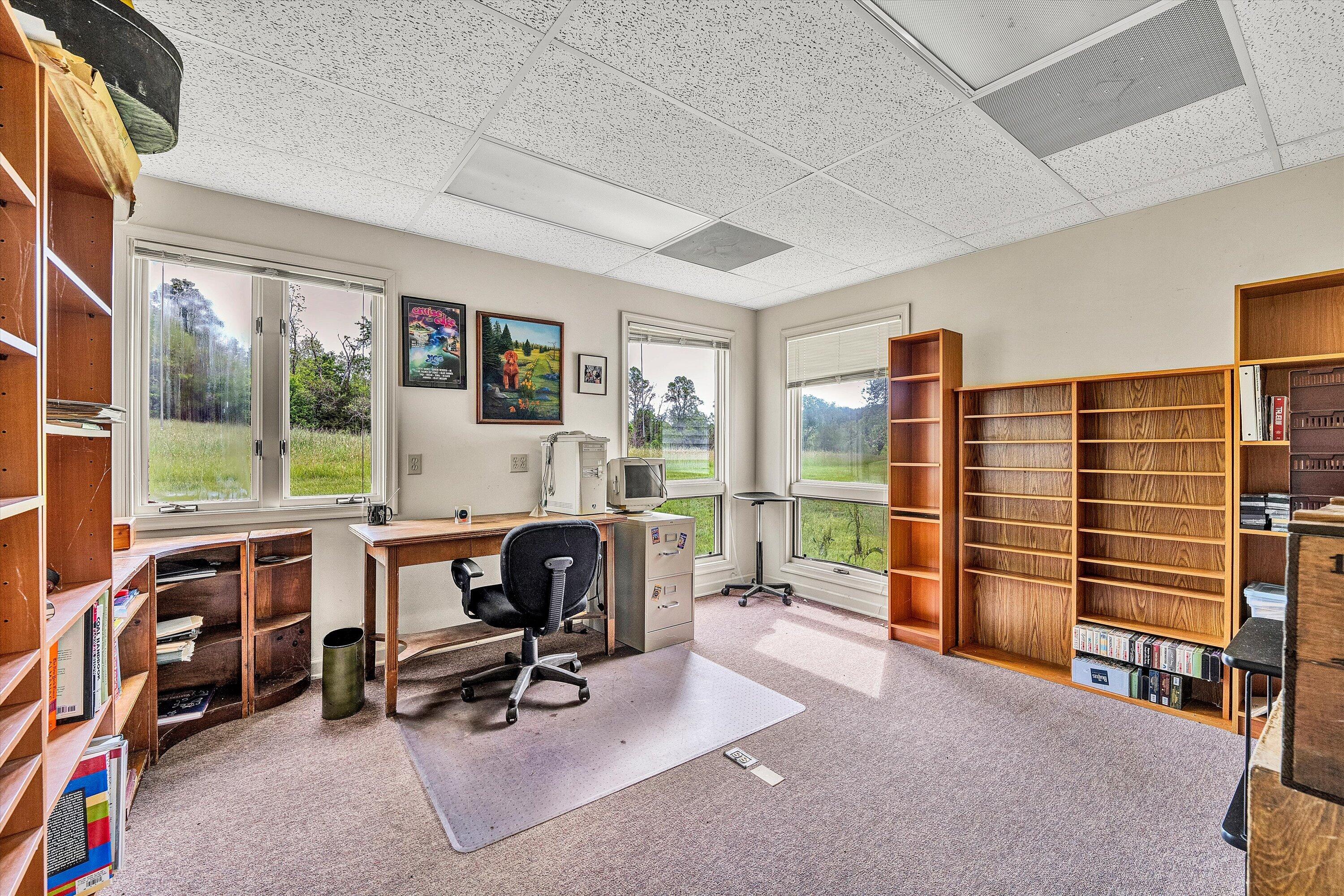 5328 White House Road Moneta, VA 24121 - Photo 26 of 39 a view of a livingroom with workspace and windows