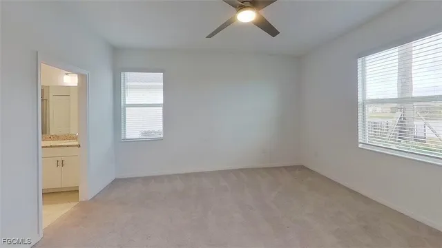 a view of swimming pool with outdoor seating and plants