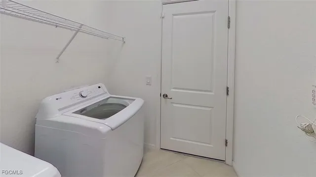 a view of a livingroom with furniture window and wooden floor