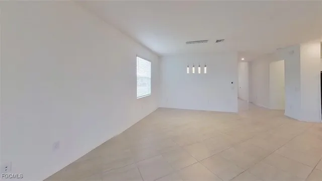 a view of swimming pool with palm trees