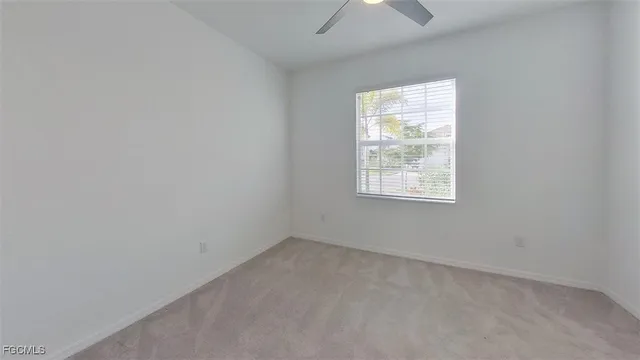 a kitchen with granite countertop stainless steel appliances a sink a stove a microwave a counter top and cabinets