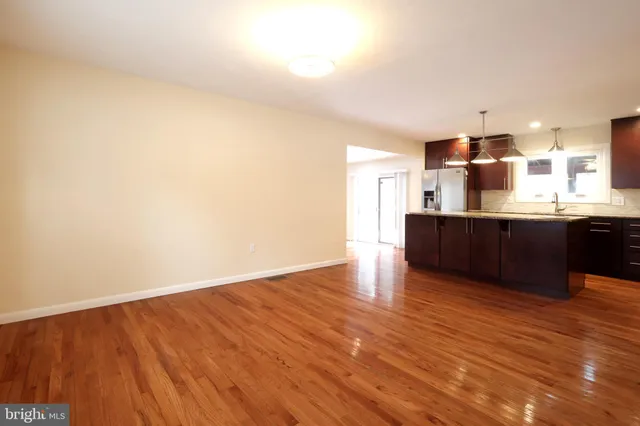 a view of kitchen with wooden floor and large window