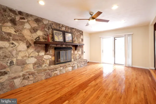 a bathroom with a sink a toilet a mirror and vanity