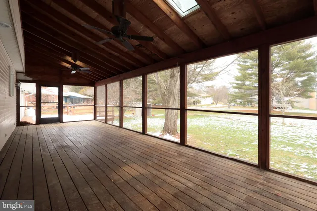 a bathroom with a granite countertop sink toilet a shower and a mirror