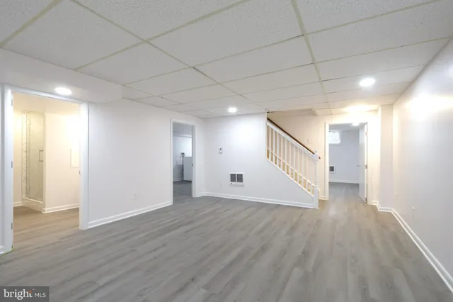 an empty room with wooden floor