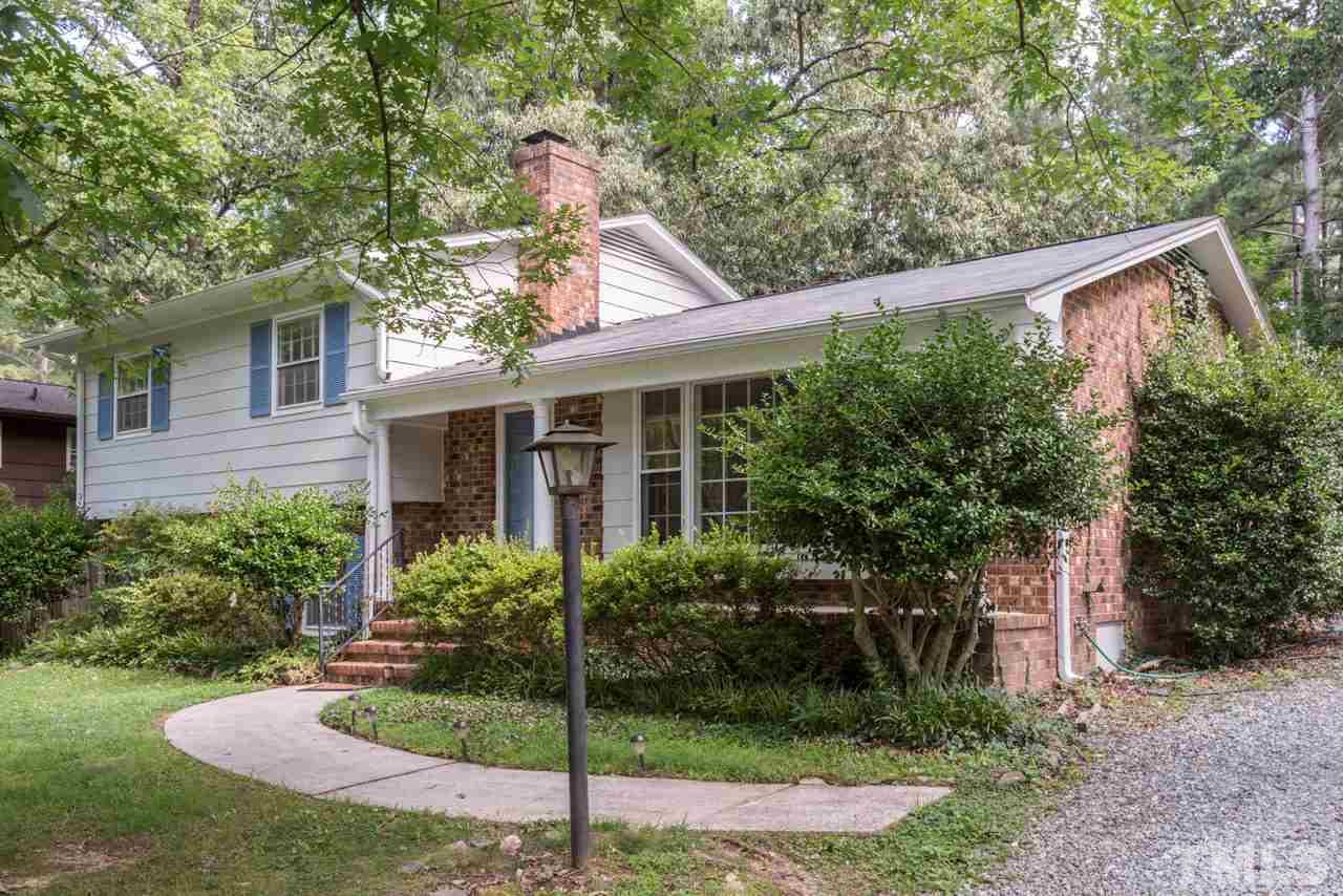 1547 Fountain Ridge Road Chapel Hill, NC 27517 - Photo 1 of 22 a view of a house with backyard and plants