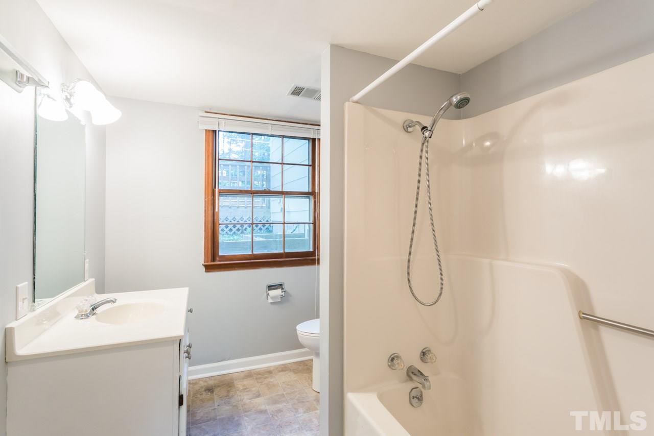 1547 Fountain Ridge Road Chapel Hill, NC 27517 - Photo 14 of 22 a bathroom with a granite countertop sink a toilet and shower