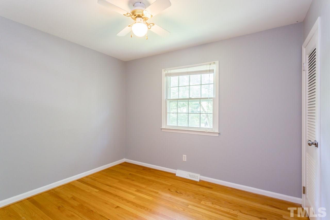 1547 Fountain Ridge Road Chapel Hill, NC 27517 - Photo 15 of 22 an empty room with a window