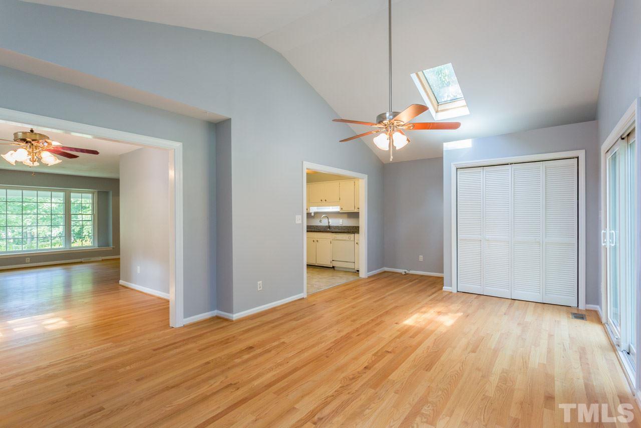 1547 Fountain Ridge Road Chapel Hill, NC 27517 - Photo 6 of 22 a view of an empty room with wooden floor and a window