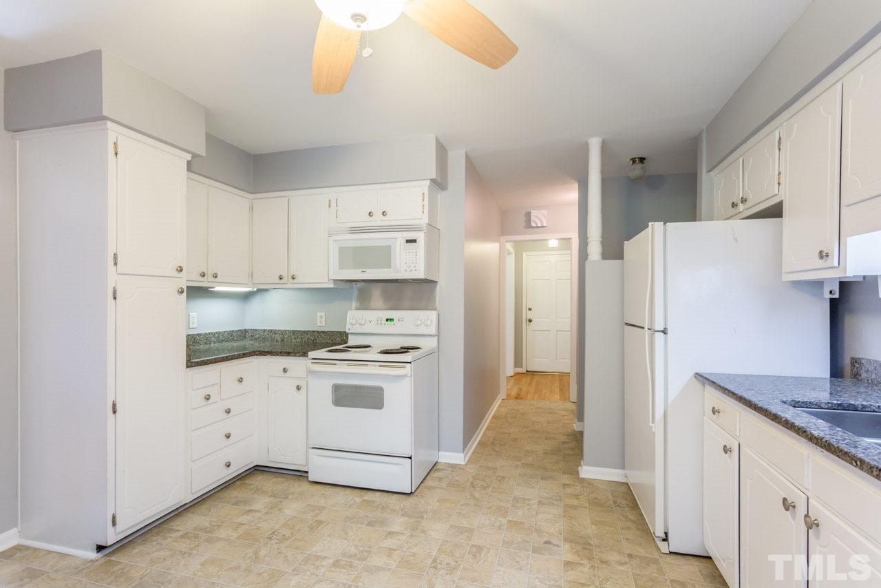 1547 Fountain Ridge Road Chapel Hill, NC 27517 - Photo 8 of 22 a kitchen with cabinets appliances and a counter space