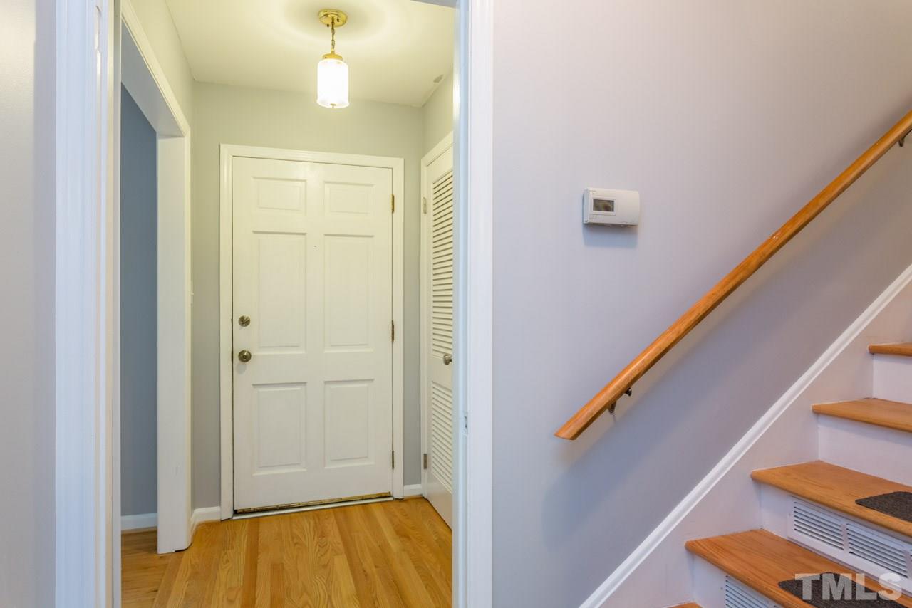 1547 Fountain Ridge Road Chapel Hill, NC 27517 - Photo 10 of 22 a view of hallway with wooden floor and stairs