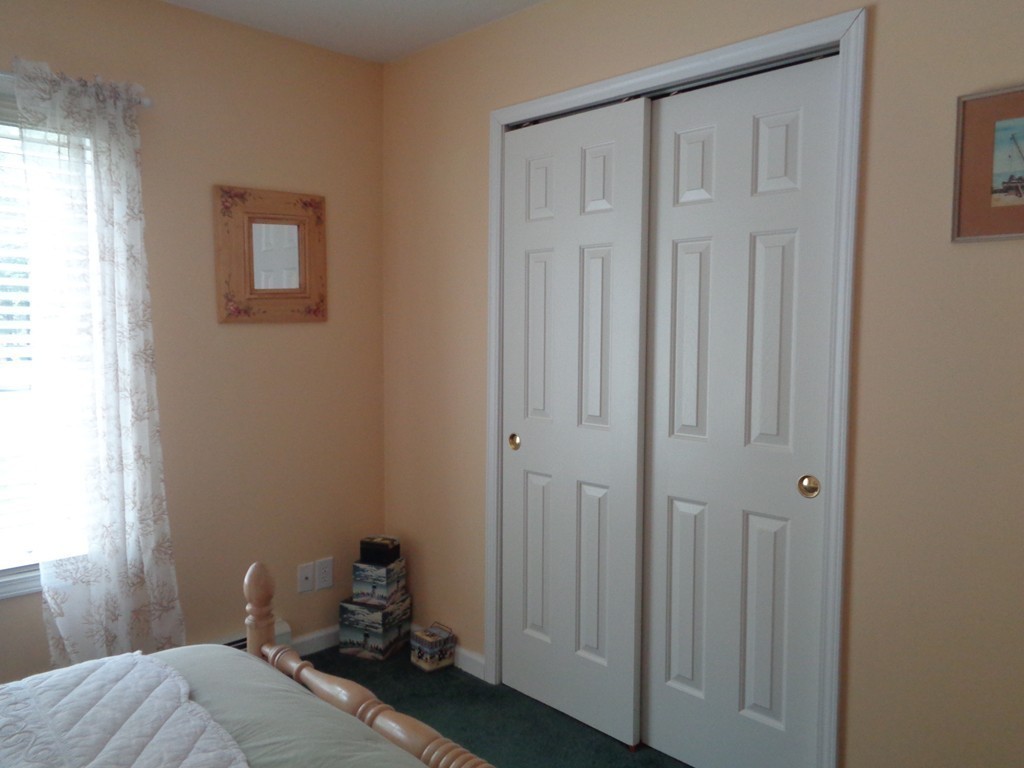 5 Cooper Road Sturbridge, MA 01566 - Photo 14 of 28 a bedroom with a bed and a window
