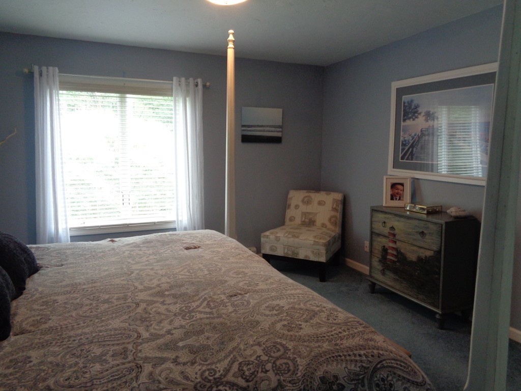 5 Cooper Road Sturbridge, MA 01566 - Photo 18 of 28 a bedroom with a bed and a window