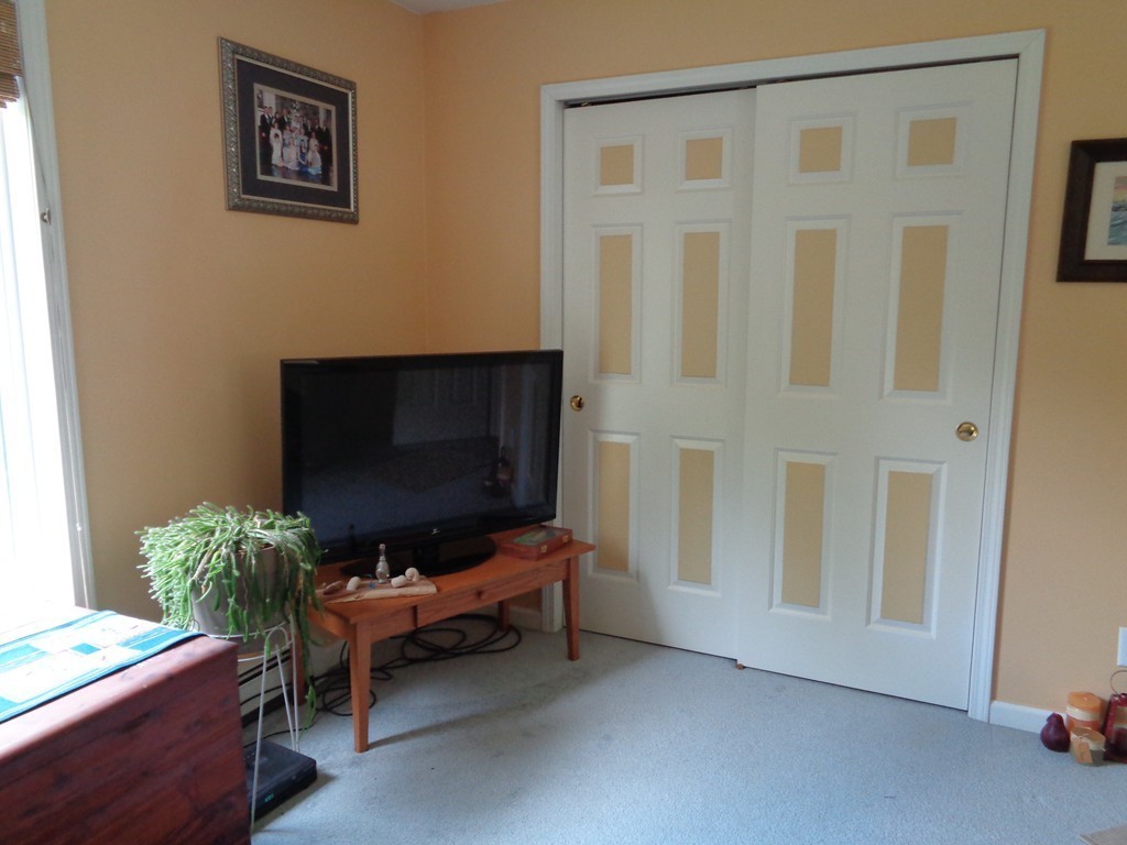 5 Cooper Road Sturbridge, MA 01566 - Photo 23 of 28 a living room with furniture and a flat screen tv