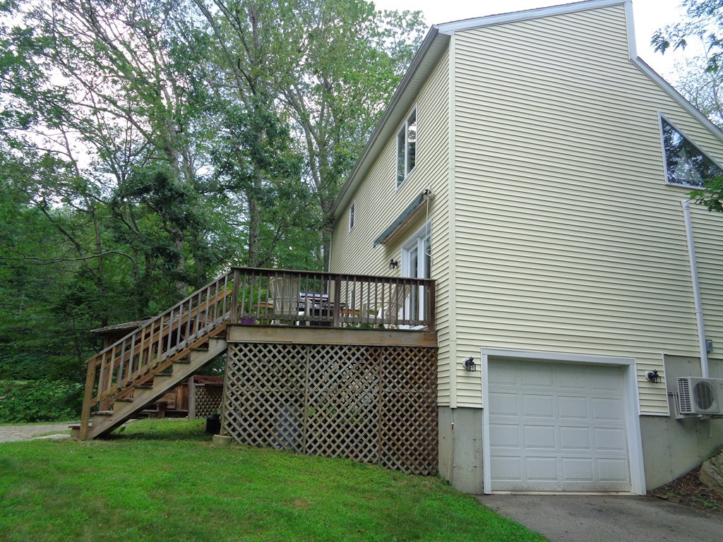 5 Cooper Road Sturbridge, MA 01566 - Photo 4 of 28 a view of a house with a yard