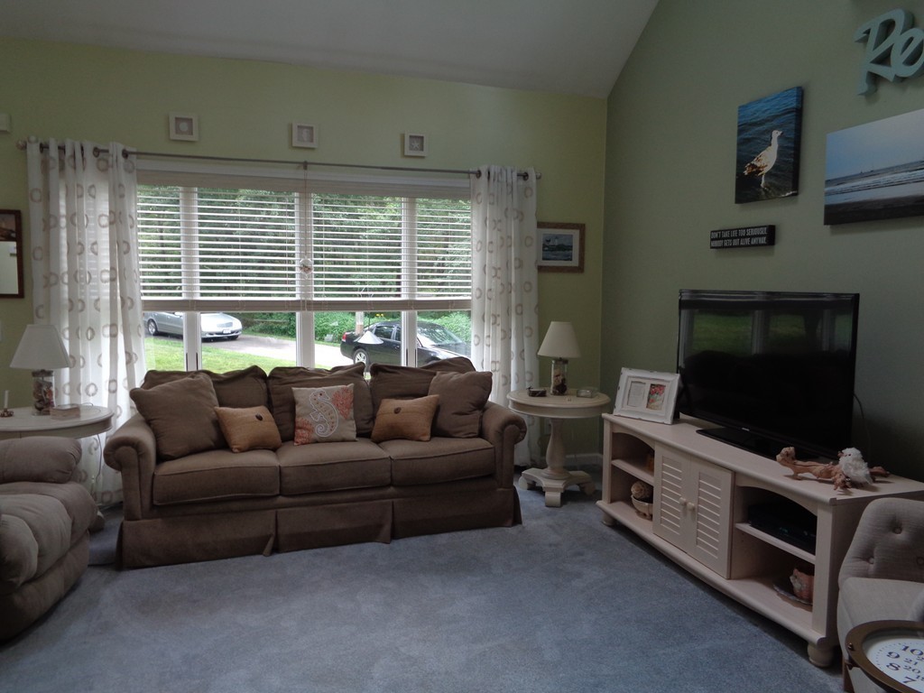 5 Cooper Road Sturbridge, MA 01566 - Photo 8 of 28 a living room with furniture and a flat screen tv