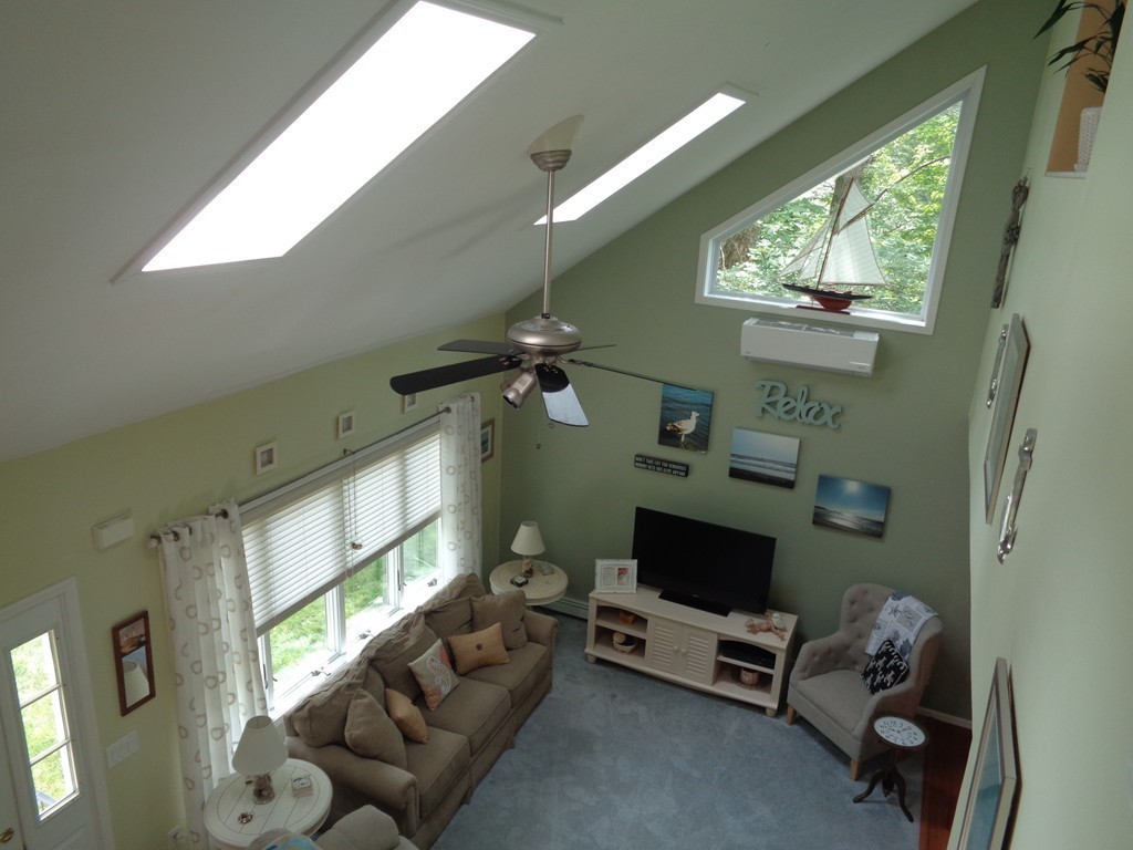 5 Cooper Road Sturbridge, MA 01566 - Photo 9 of 28 a living room with furniture and a flat screen tv