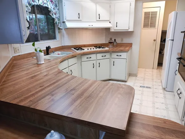 a kitchen with a sink and cabinets