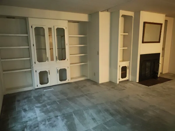 a view of an empty room with a door