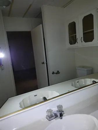 a view of an empty room with a fireplace