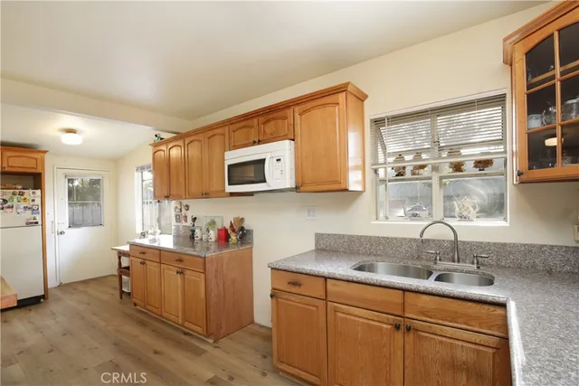 a kitchen with sink cabinets and window