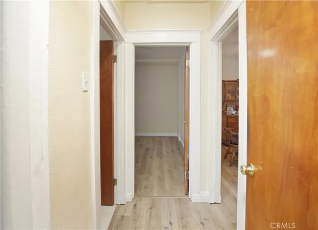 a view of a bathroom from a hallway