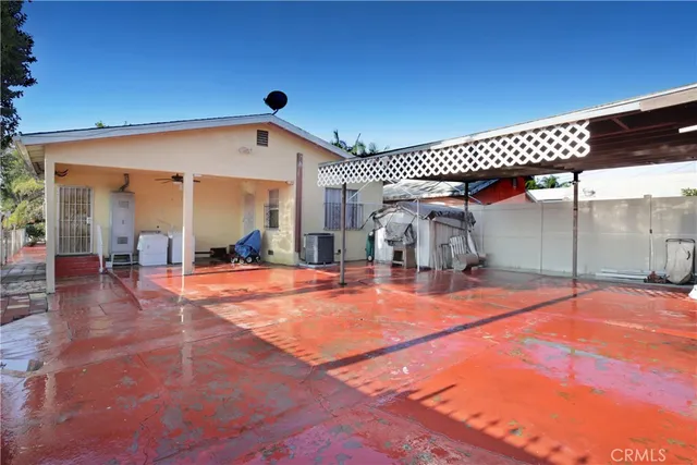 an outdoor space with pool and furniture