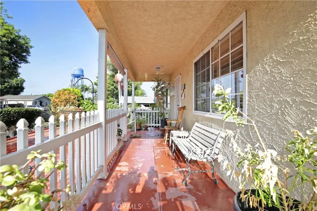 a view of balcony with wooden floor