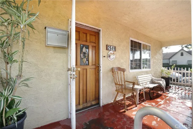 a view of a livingroom with furniture and window