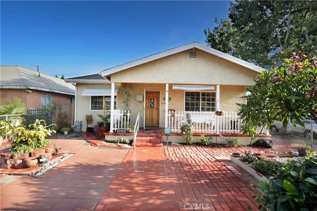 a backyard of a house with outdoor seating