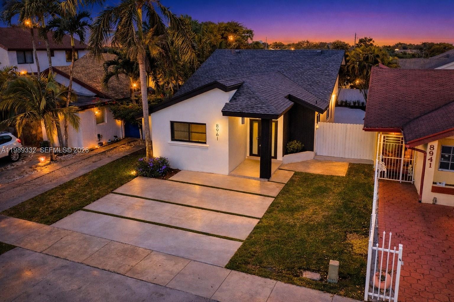 8961 Southwest 6th Street Miami, FL 33174 - Photo 1 of 26 a front view of a house with a yard