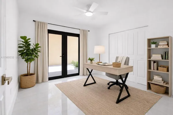 a view of a livingroom with furniture and a potted plant