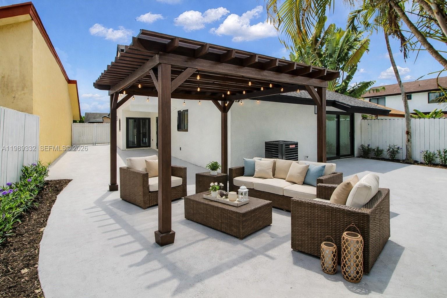 8961 Southwest 6th Street Miami, FL 33174 - Photo 13 of 26 a view of a couches and dinning table in patio