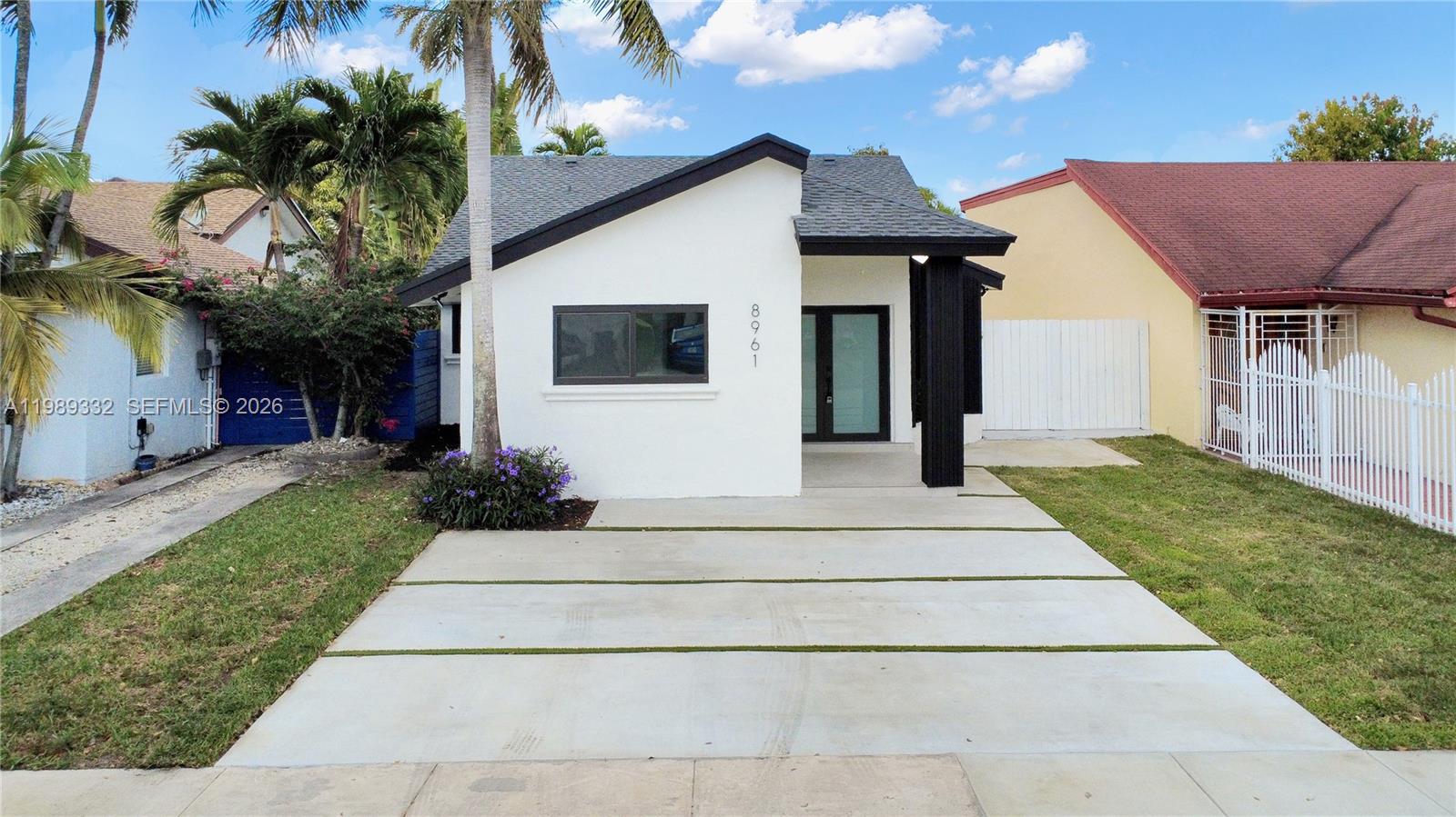 8961 Southwest 6th Street Miami, FL 33174 - Photo 14 of 26 a front view of house with yard and green space
