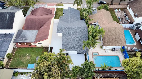 an aerial view of a house with outdoor space