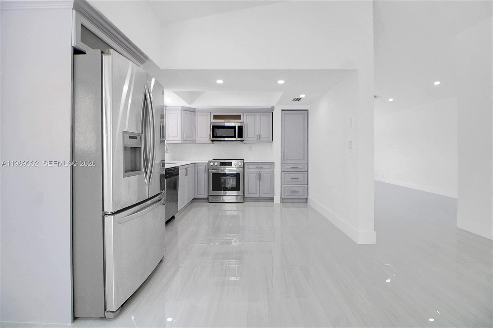 8961 Southwest 6th Street Miami, FL 33174 - Photo 18 of 26 a kitchen with stainless steel appliances granite countertop a refrigerator and a stove