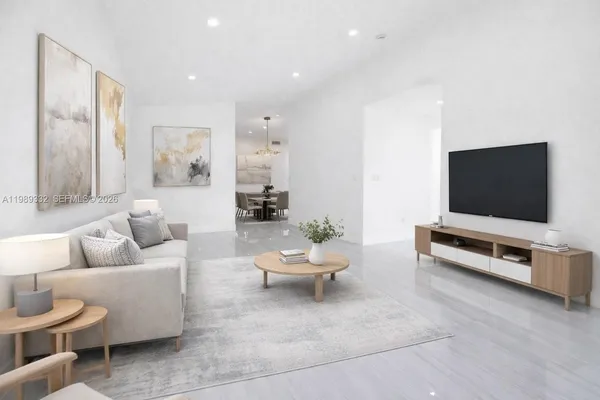 a living room with furniture and a flat screen tv