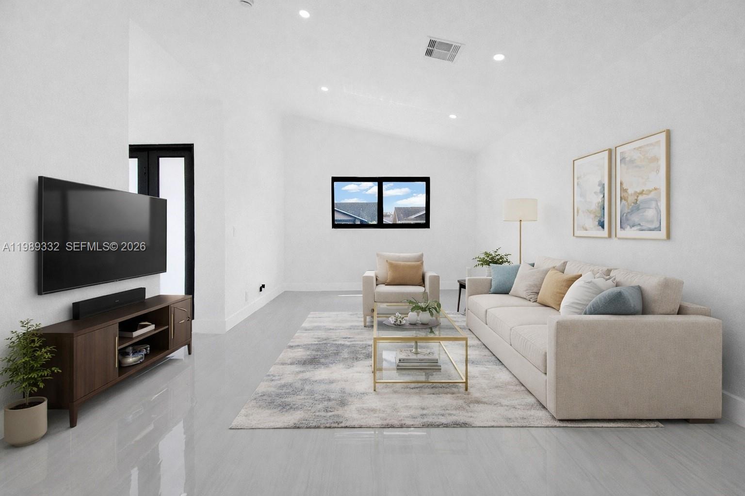 8961 Southwest 6th Street Miami, FL 33174 - Photo 6 of 26 a living room with furniture and a flat screen tv