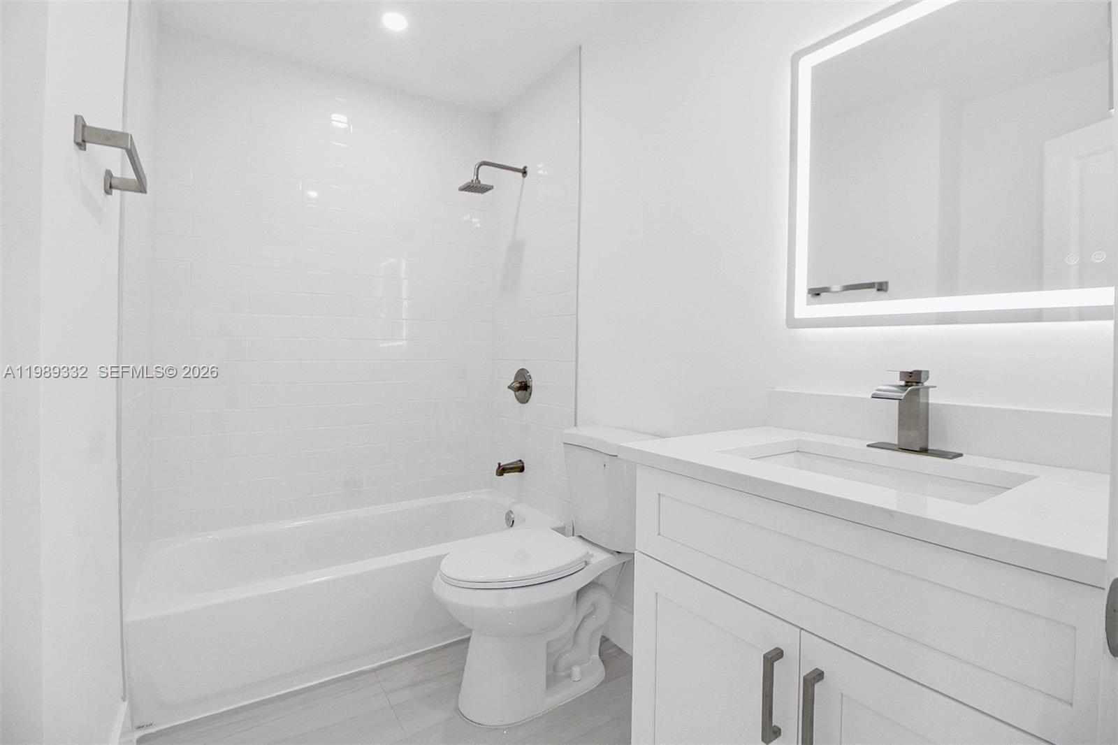 8961 Southwest 6th Street Miami, FL 33174 - Photo 7 of 26 a bathroom with a sink a toilet and shower